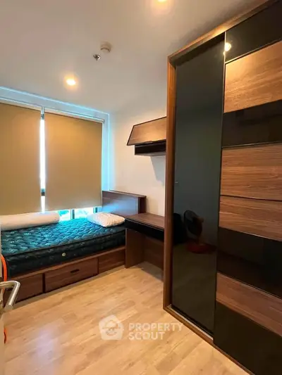 Modern bedroom with sleek wooden furniture and natural light