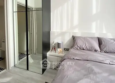 Modern bedroom with sleek design and ample natural light