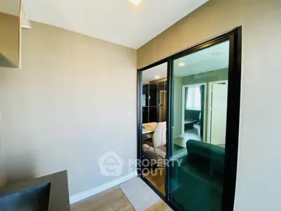 Modern interior with glass sliding doors and cozy living area