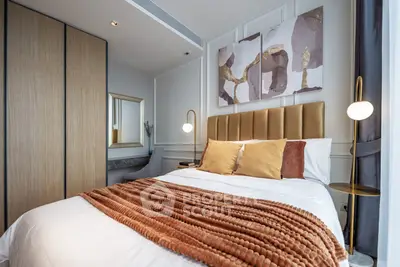 Luxurious bedroom with modern decor and cozy ambiance in a stylish apartment.