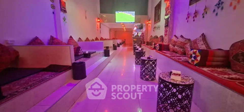 Luxurious lounge with vibrant decor and cozy seating, perfect for relaxation and entertainment.