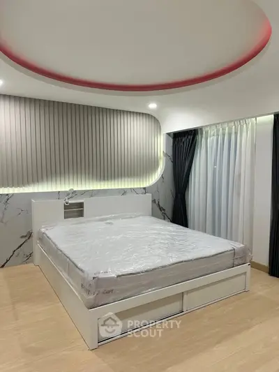 Modern bedroom with stylish ceiling design and elegant lighting