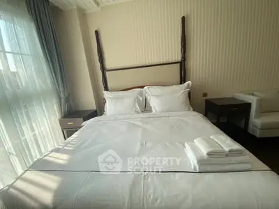 Luxurious bedroom with elegant four-poster bed and natural light