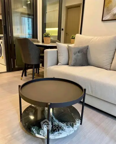 Modern living room with stylish furniture and elegant decor in a cozy apartment setting.
