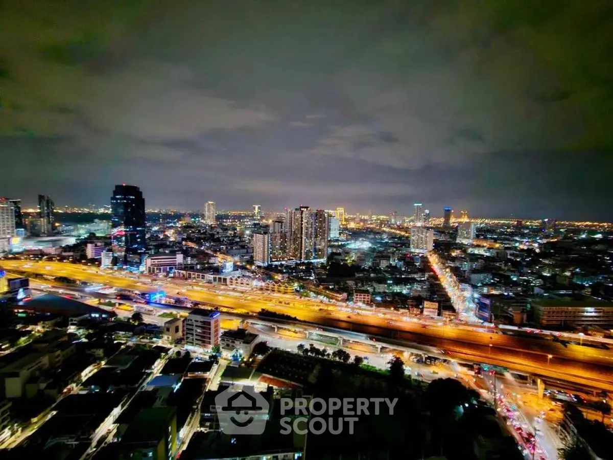 Stunning cityscape view with vibrant night lights and bustling streets.