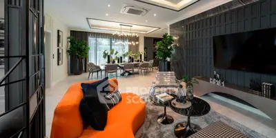 Luxurious modern living room with vibrant orange sofa and elegant dining area, perfect for stylish entertaining.