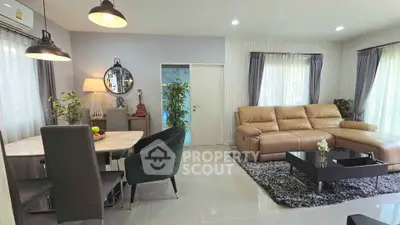 Spacious modern living room with elegant decor and cozy seating area.