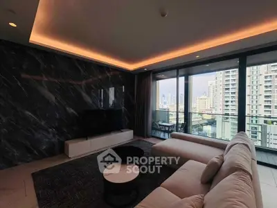 Luxurious living room with modern decor and stunning city view from large windows.