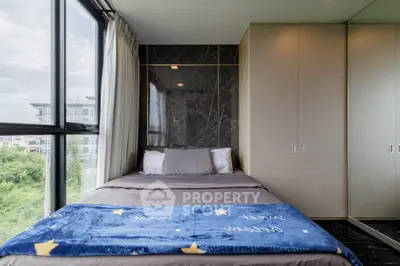 Luxurious bedroom with panoramic window and elegant decor