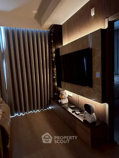Modern living room with sleek TV setup and ambient lighting