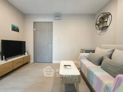 Modern living room with stylish furniture and wall decor
