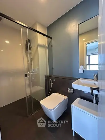 Modern bathroom with sleek design and glass shower enclosure