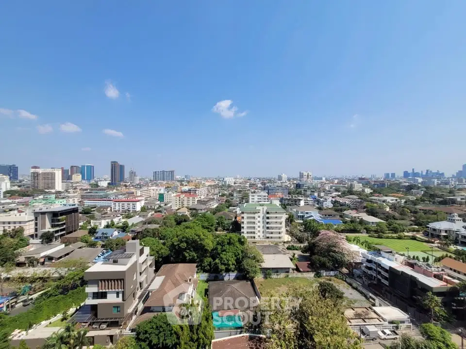 Stunning cityscape view showcasing urban skyline and lush greenery, perfect for real estate investment.