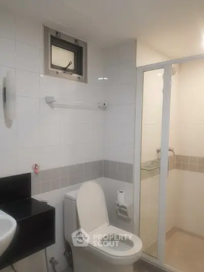 Modern bathroom with sleek design and glass shower enclosure