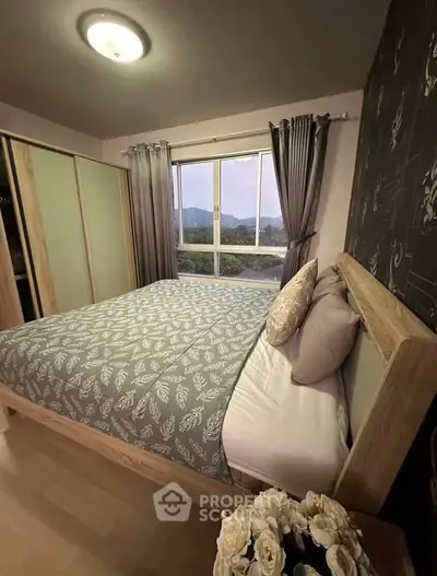 Cozy bedroom with scenic window view and elegant decor