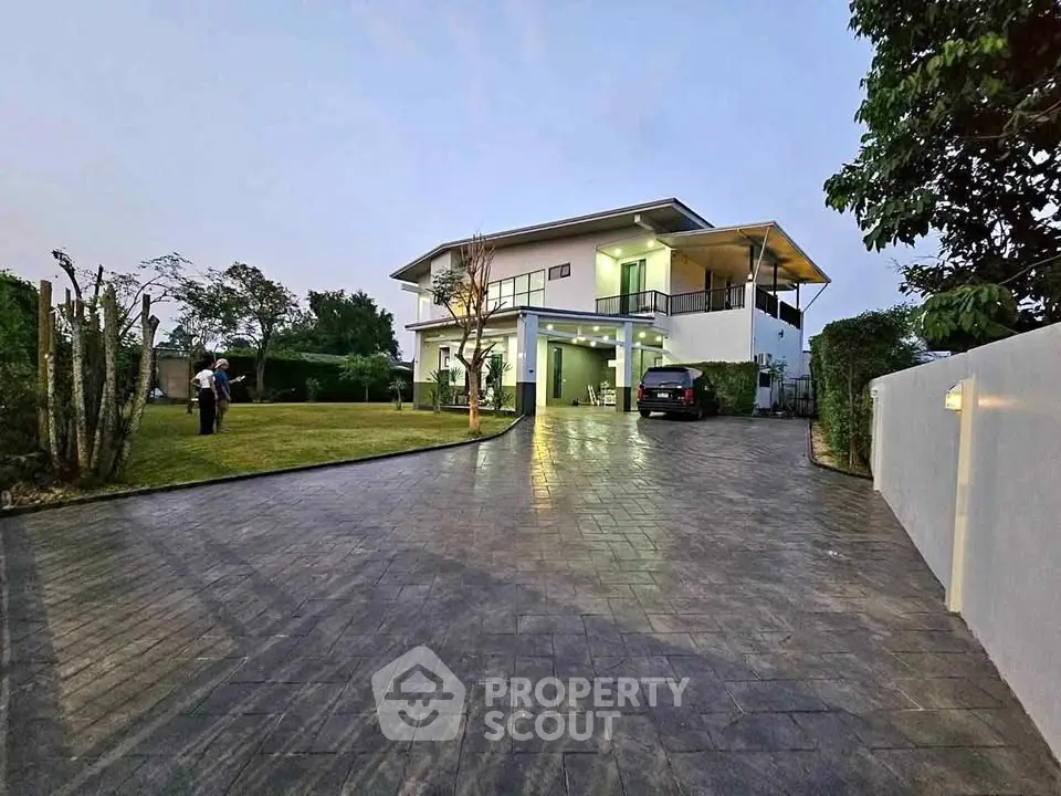 Stunning modern home with spacious driveway and lush garden, perfect for luxury living.
