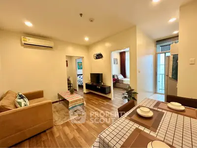 Spacious open-plan living and dining area with modern decor and natural light.