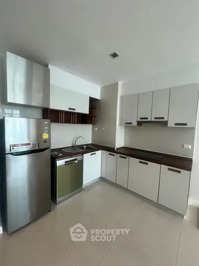 Modern kitchen with sleek cabinetry and stainless steel appliances