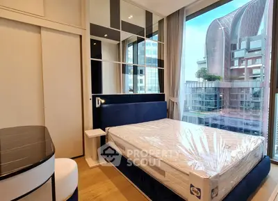 Luxurious bedroom with modern design and stunning city view, featuring a plush bed and floor-to-ceiling windows.