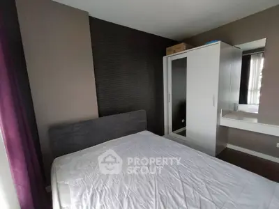 Modern bedroom with sleek wardrobe and minimalist decor