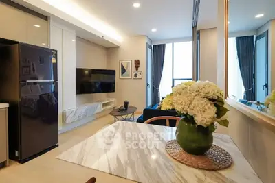 Modern living room with open kitchen and elegant decor
