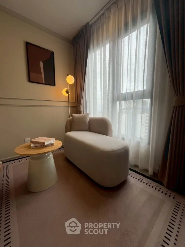 Cozy corner with modern chair and soft lighting in elegant living space.