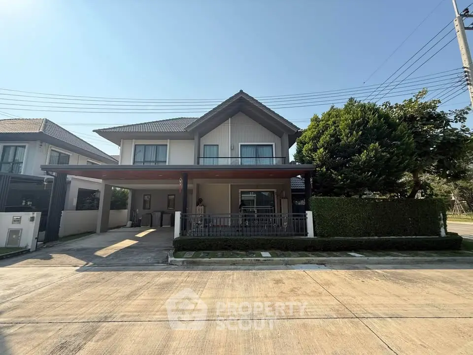 Charming two-story house with spacious driveway and lush greenery in a serene neighborhood.