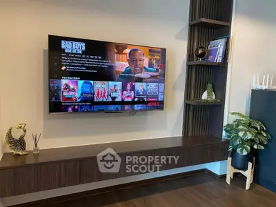 Modern living room with wall-mounted TV and stylish decor
