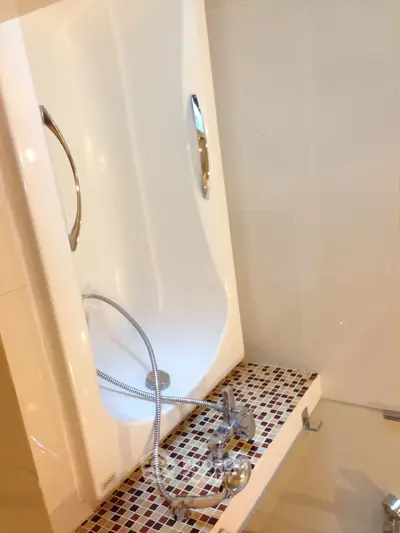 Modern bathroom with sleek bathtub and stylish tile flooring