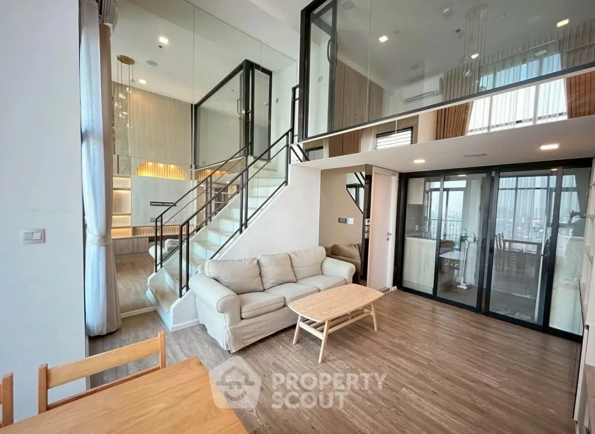 Spacious modern living room with mezzanine and elegant glass partitions