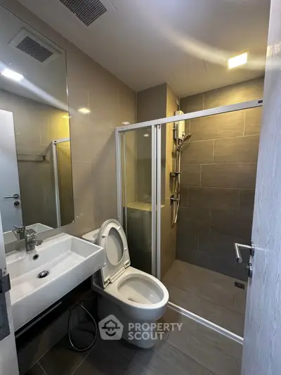 Modern bathroom with sleek shower and contemporary fixtures