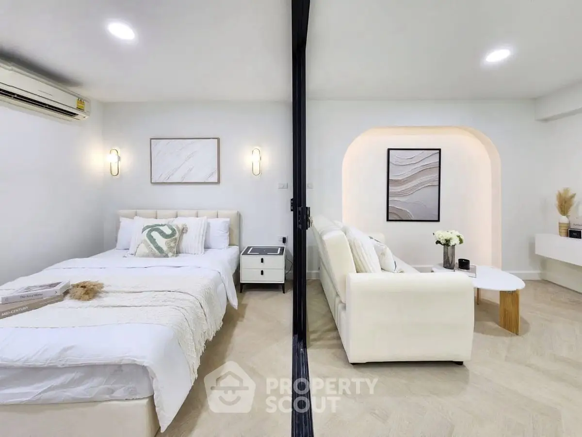 Modern dual-purpose room with cozy bedroom and stylish living area