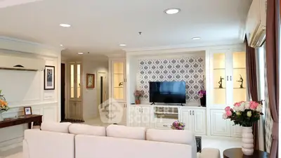Elegant living room with stylish decor and built-in TV unit, perfect for modern living.