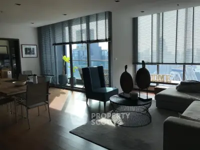 Spacious modern living room with large windows and city view