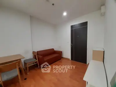 Cozy living room with wooden flooring and minimalist furniture