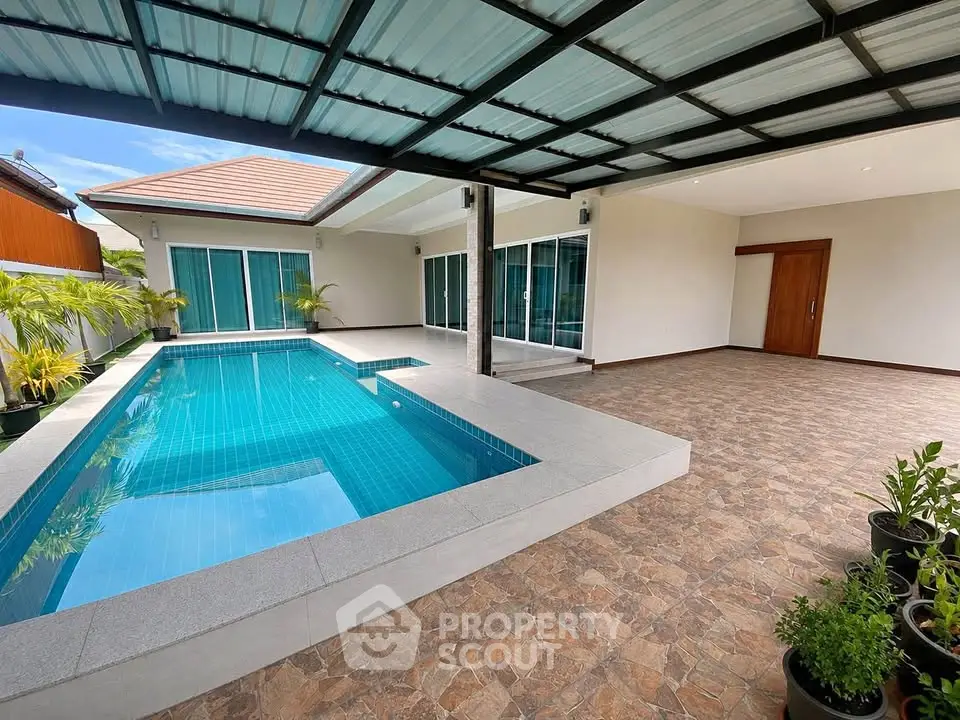 Luxurious modern home with private pool and spacious patio, perfect for relaxation and entertainment.