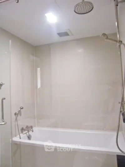 Modern bathroom with sleek bathtub and rainfall showerhead
