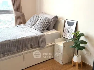 Cozy bedroom with stylish decor and city view, featuring a plush bed and modern artwork.