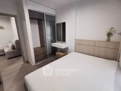 Modern bedroom with sleek design and spacious layout in a stylish apartment.