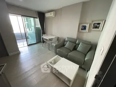 Modern living room with balcony access and stylish furniture