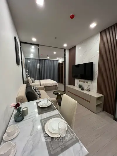 Modern open-plan living room with stylish decor and cozy ambiance