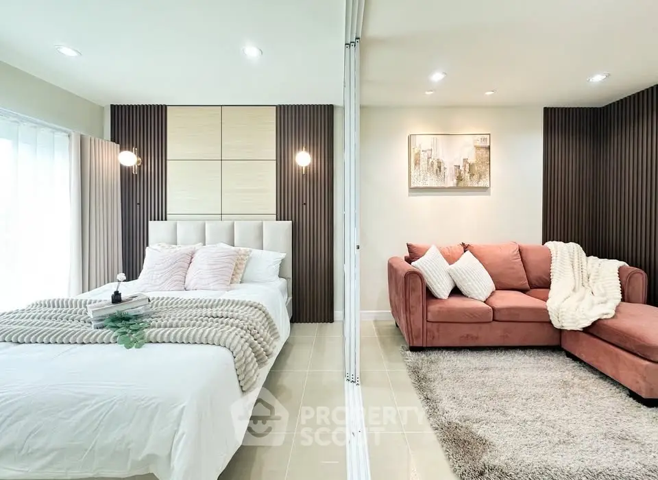 Luxurious bedroom with stylish decor and cozy seating area, perfect for relaxation.