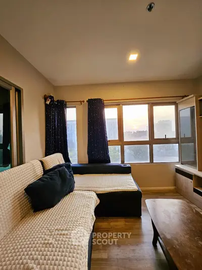 Cozy living room with large windows and stylish furniture