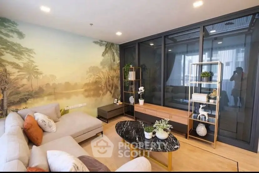 Luxurious living room with elegant decor and scenic wall mural, featuring a modern sofa and stylish coffee table.