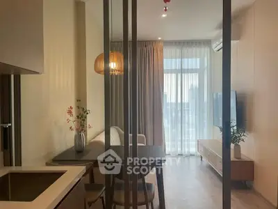 Modern living room with stylish decor and large window offering city view
