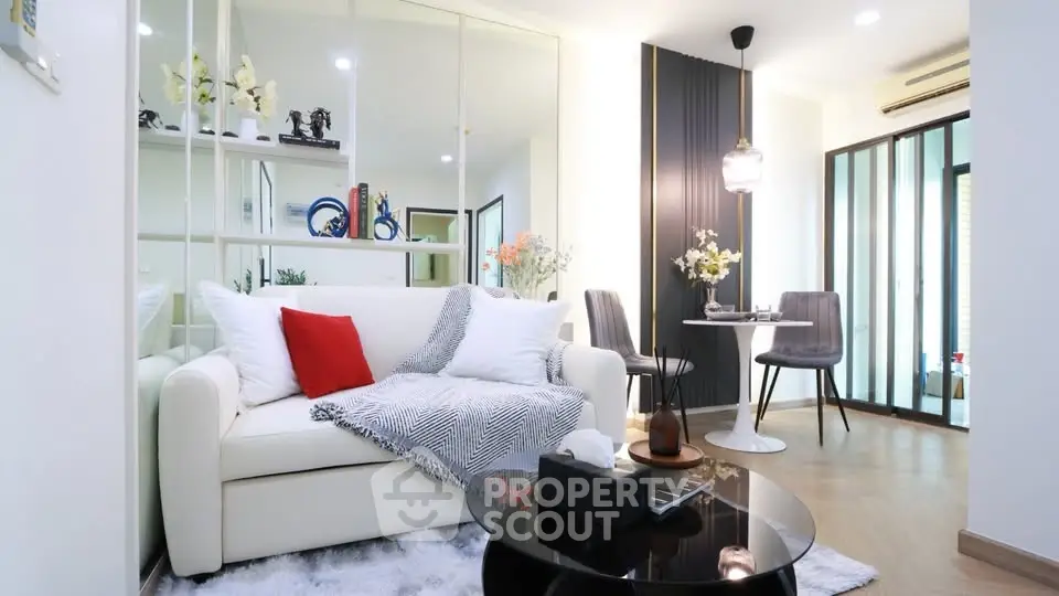 Modern living room with stylish decor and cozy ambiance in a contemporary apartment.