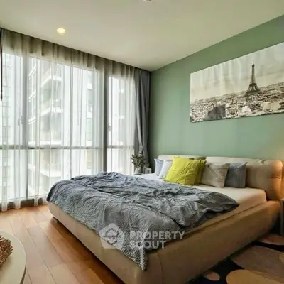 Modern bedroom with large windows and stylish decor in urban apartment