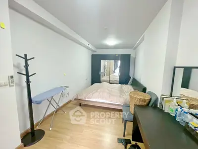 Cozy bedroom with modern furnishings and ample storage space, perfect for comfortable living.