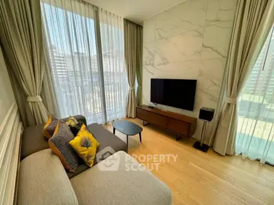 Stylish modern living room with large windows and elegant decor