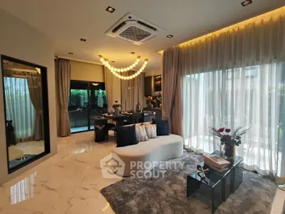 Luxurious modern living room with elegant decor and large windows